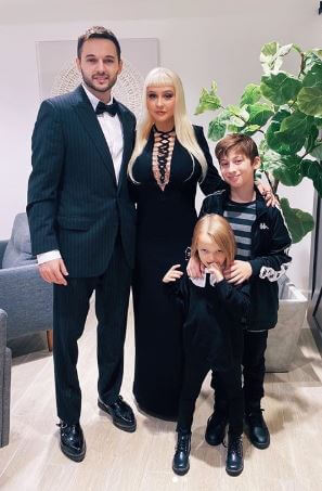 Christina with her fiancé and children.